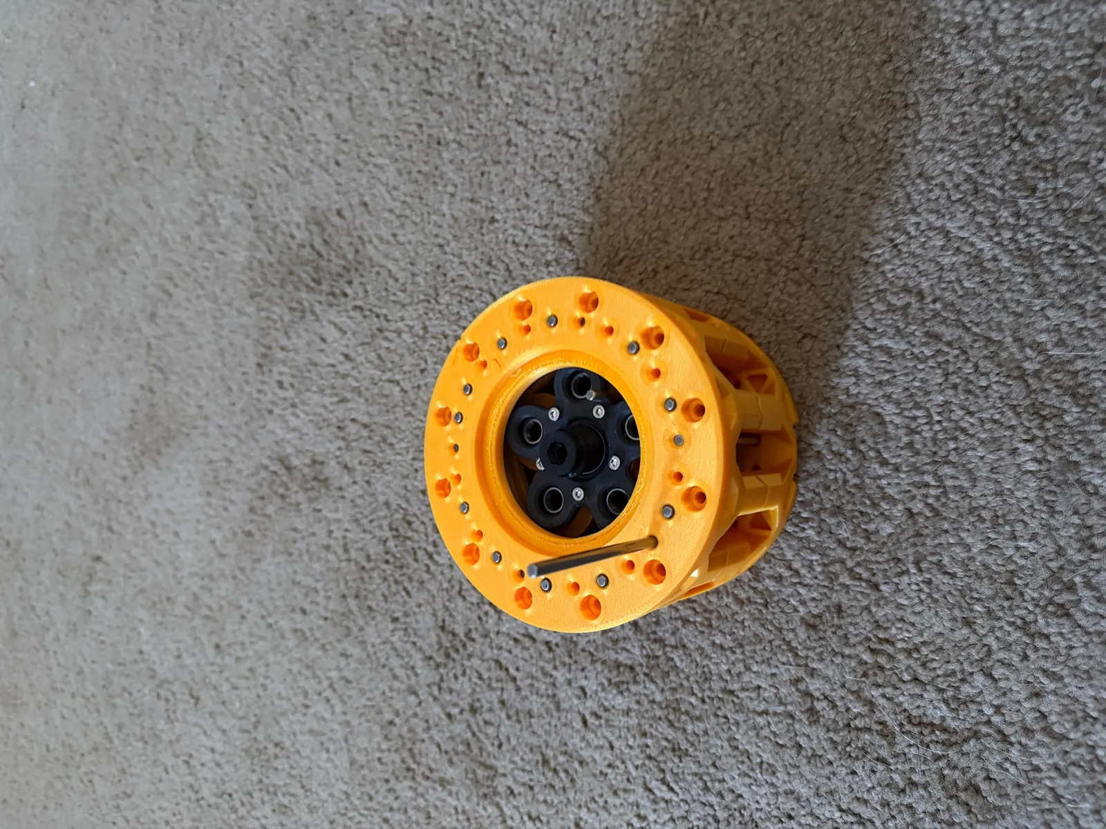 A printed cycloidal gearbox assembly with its pin ring exposed