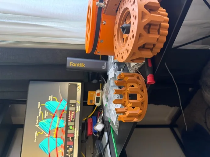 Cycloidal gearbox parts fresh off the print bed next to the printer