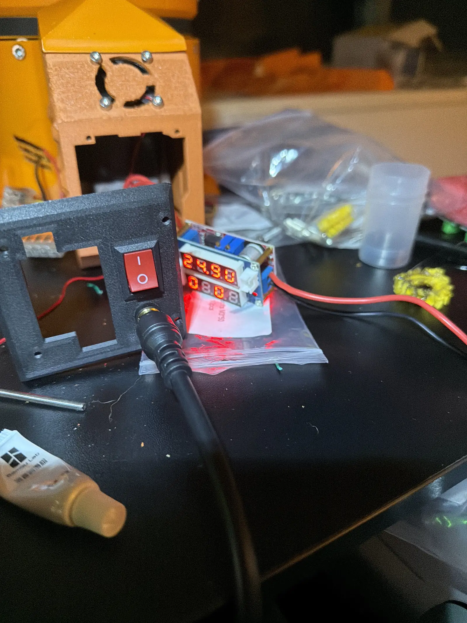 The rewire in progress: switch, connector and loose conductors on the bench