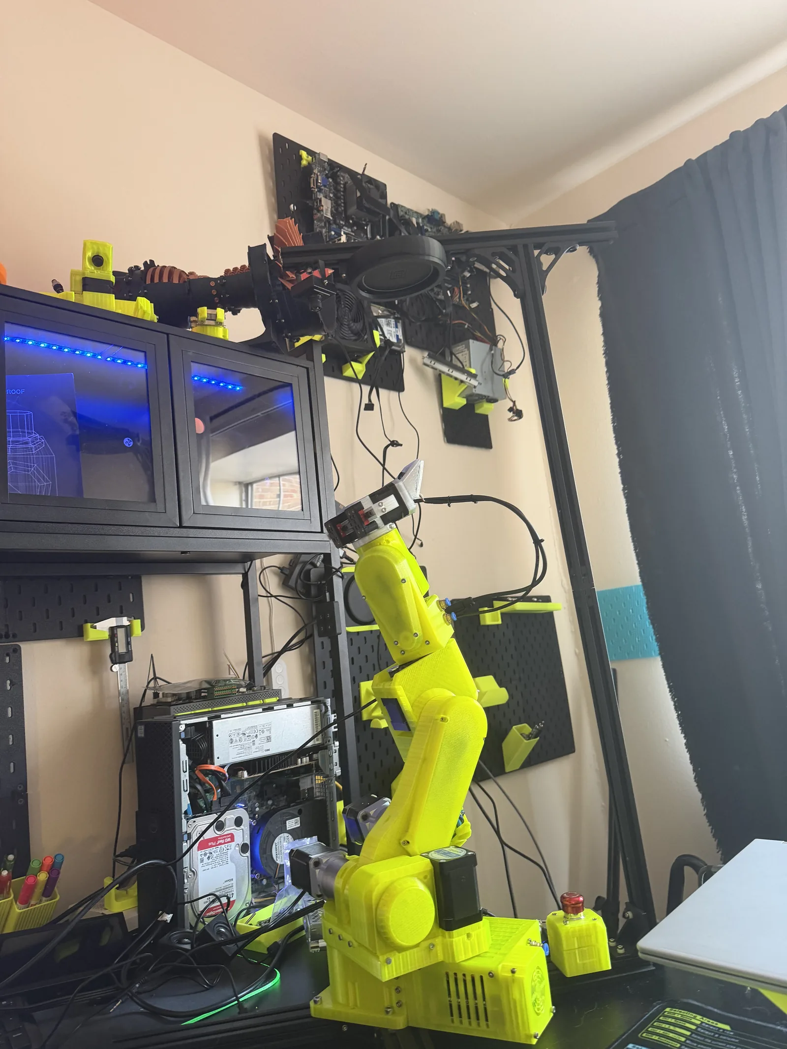 VOLT installed at the workbench beside monitors and a 3D printer