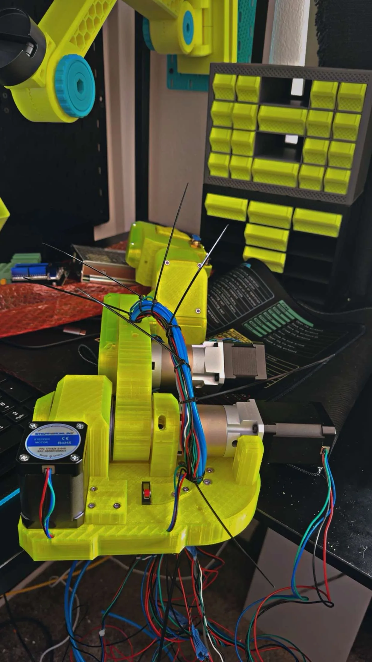 A close view of VOLT's yellow printed forearm and wrist assembly