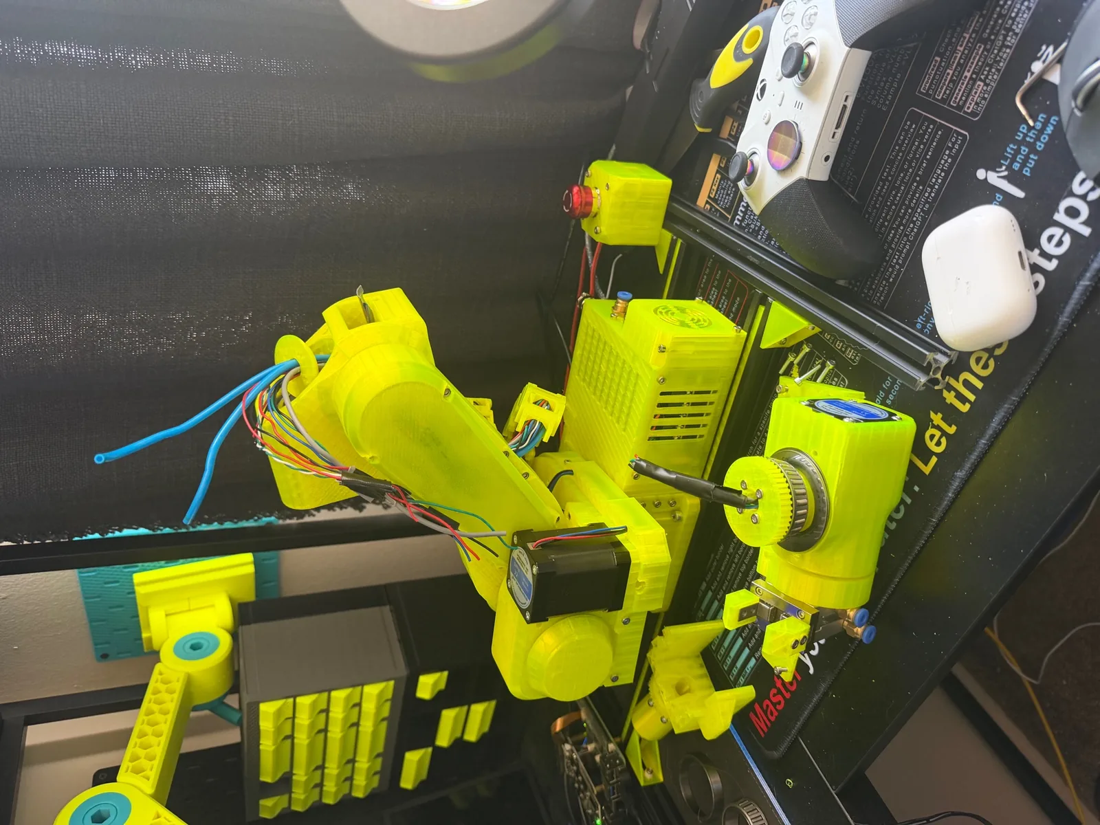 VOLT on the desk mid-build with tools and printed parts around it