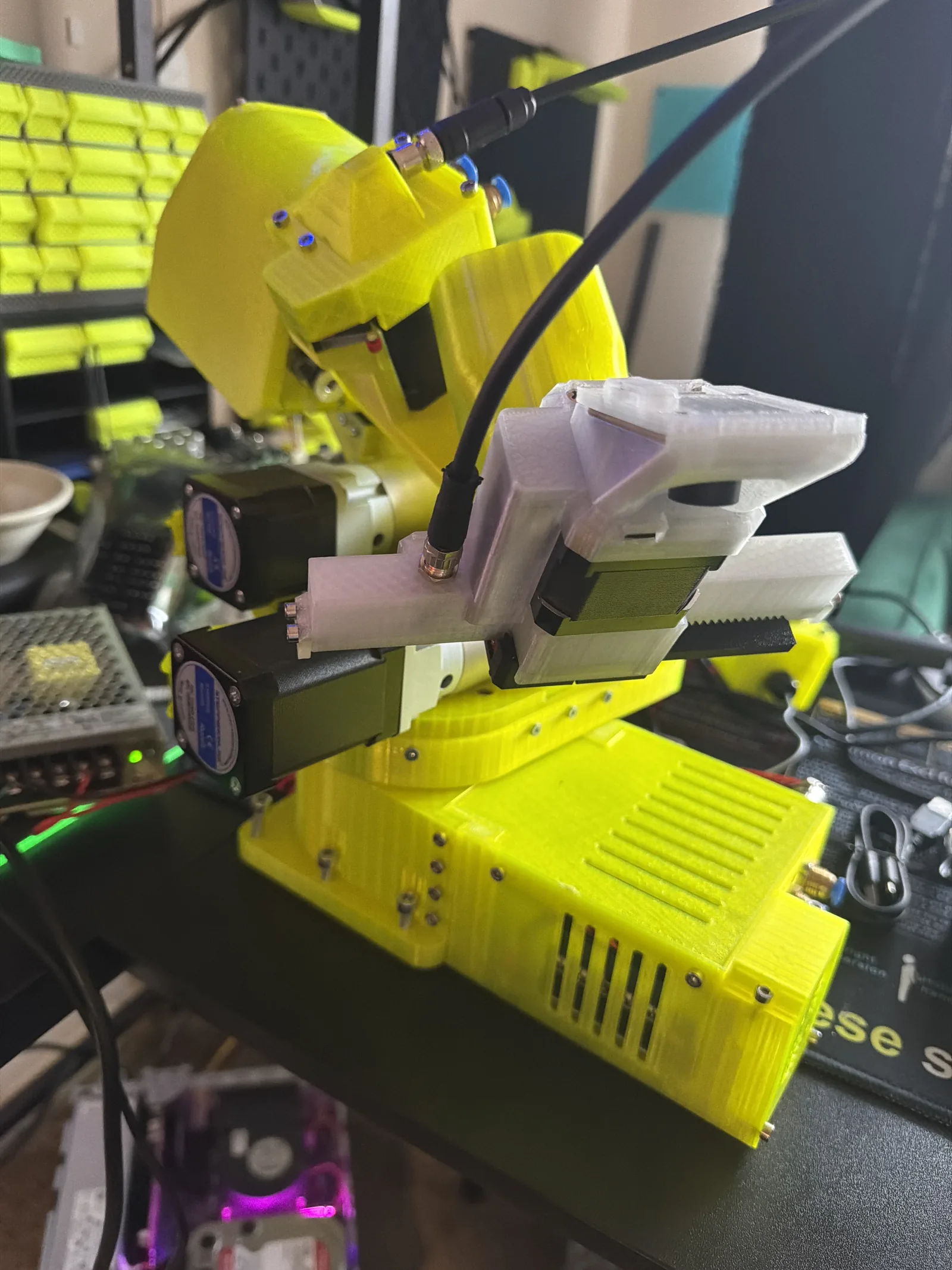 The gripper holding a part, fingers closed and loaded