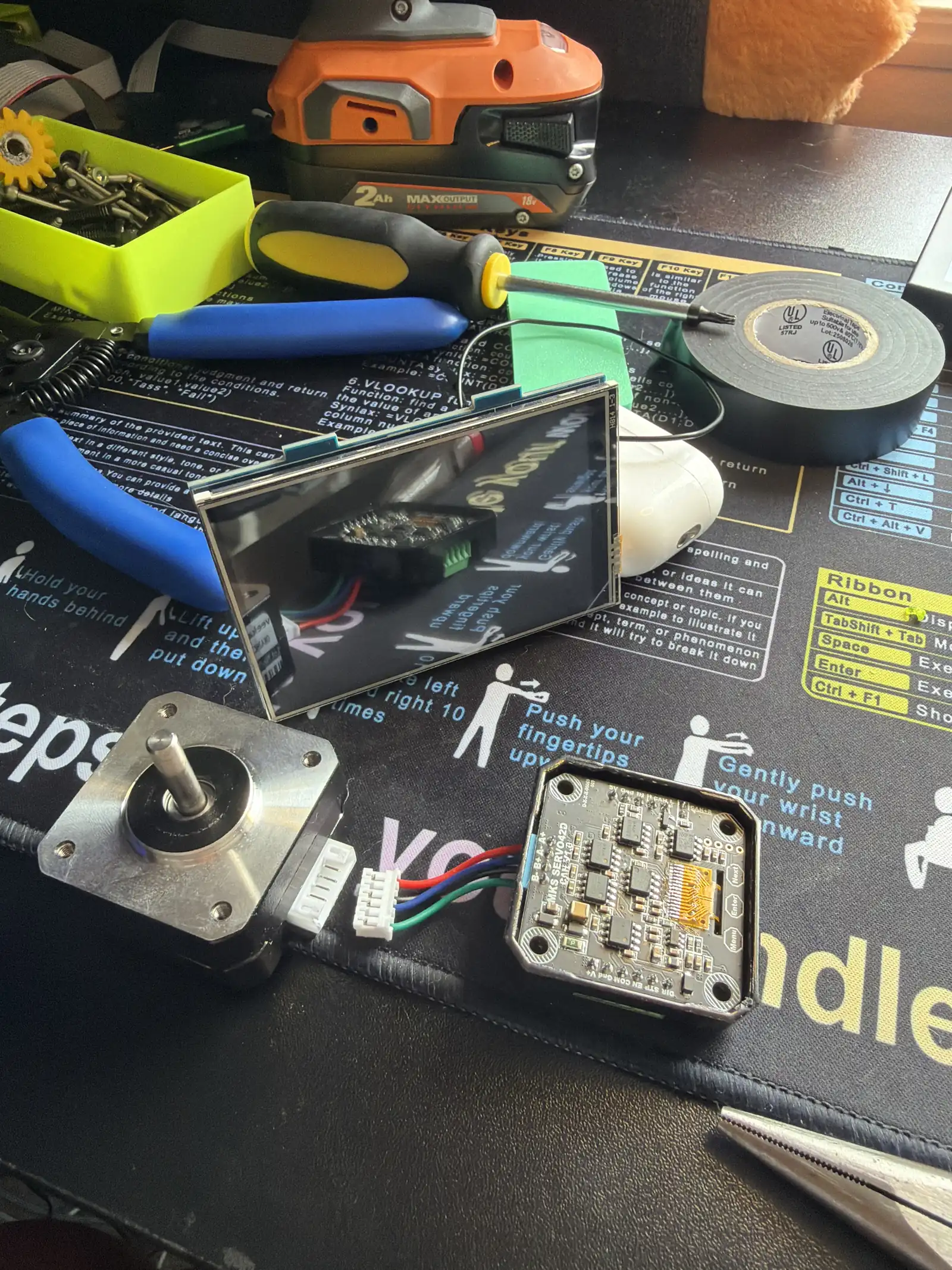 Stepper motor and control board being fitted during gripper assembly