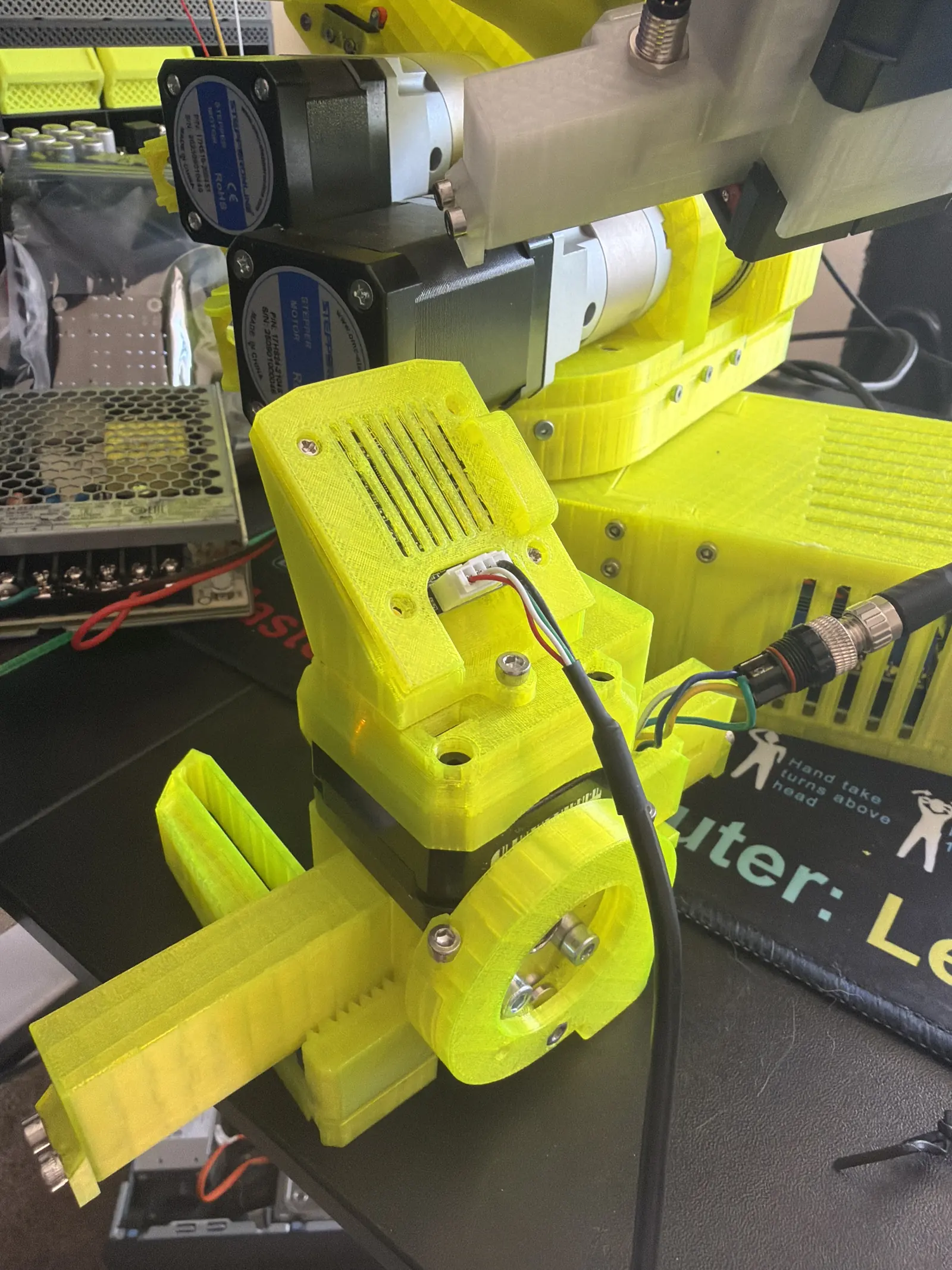 A tight view of the gripper closed at the end of a grasp attempt